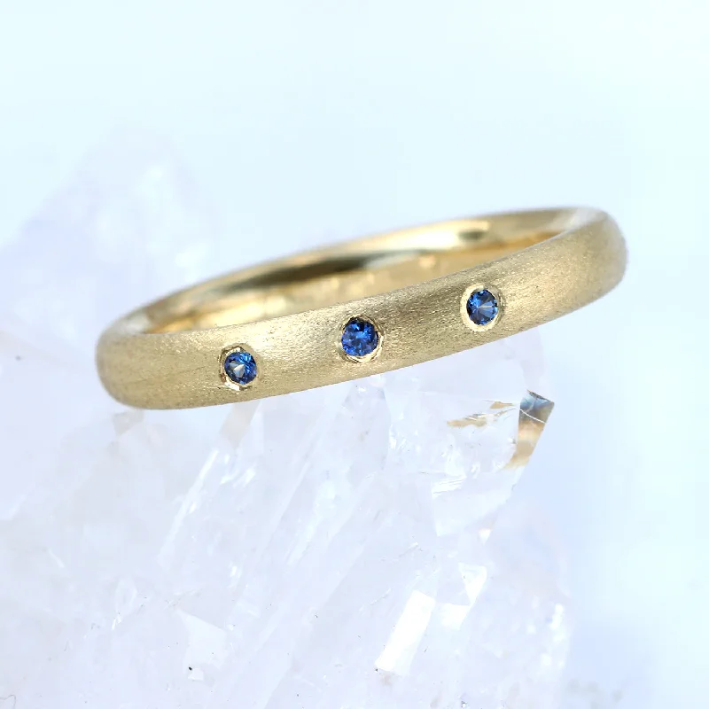 Wedding Bands with Micro - Pave Diamond AccentsCustom Blue Sapphire Eternity/Wedding Band in 18ct Gold