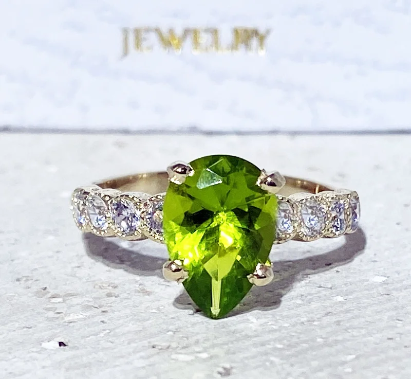 Sapphire Gemstone Rings in a Cathedral SettingPeridot Ring - August Birthstone - Statement Engagement Ring with Pear-Shaped Peridot Gemstone and Clear Quartz Accents