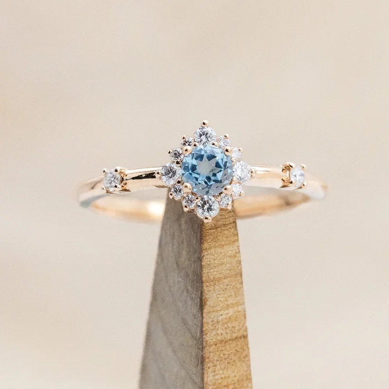 "STARLA" - ROUND CUT BLUE TOPAZ ENGAGEMENT RING WITH STARBURST DIAMOND HALO