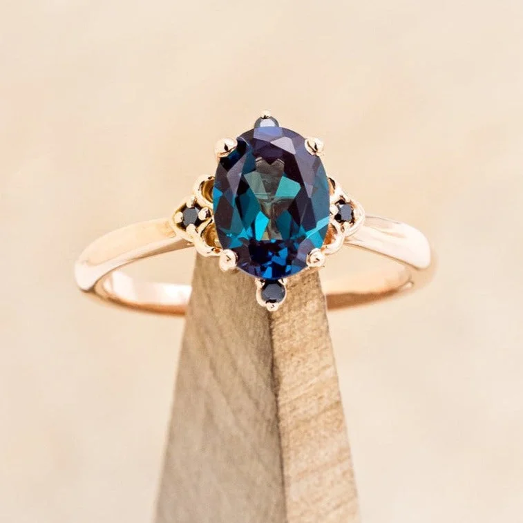 "ZELLA" - OVAL CUT LAB-GROWN ALEXANDRITE ENGAGEMENT RING WITH BLACK DIAMOND ACCENTS