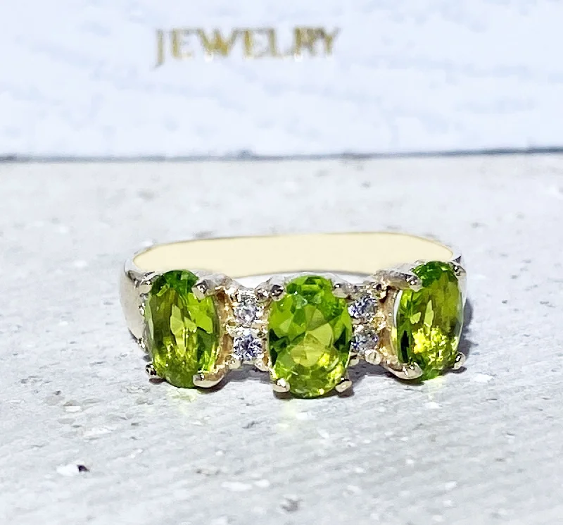 Sapphire Gemstone Rings in a Cathedral SettingPeridot Ring - August Birthstone - Ring with Three Oval Peridot Gemstones and Clear Quartz Accents