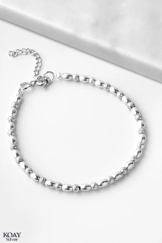 Stackable Bangle Sets for a Trendy LookSilver Oval And Balls Bracelet