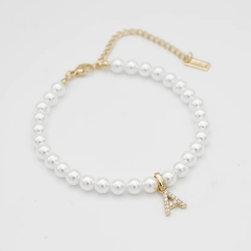 Stackable Bangle Sets for a Trendy LookICY Pearl Initial Bracelet