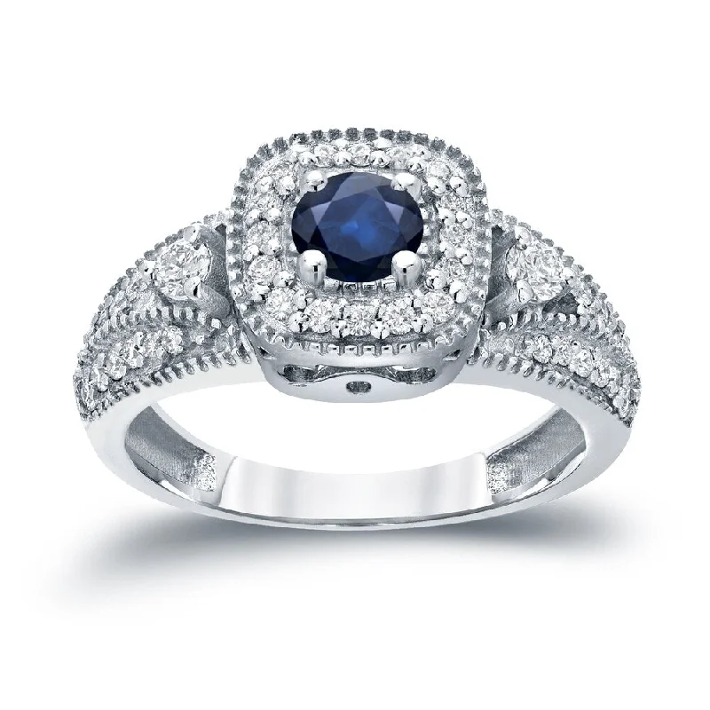 Minimalist Engagement Rings for a Simple and Elegant LookThree Stone 1/5ct Blue Sapphire and 2/5ct TDW Diamond Halo Engagement Ring in 14k Gold by Auriya